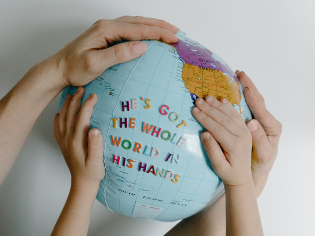Hands on a Globe